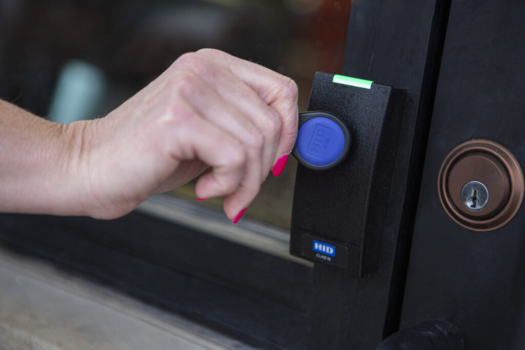 Key fob being used for entry into gym space